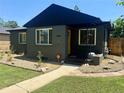 Inviting home exterior with well-kept lawn, a walkway, and modern windows, creating a warm curb appeal at 1560 Quince St, Denver, CO 80220
