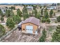 Outbuilding with a large garage door and convenient parking perfect for storing recreational vehicles at 3562 Pine Meadow Ave, Parker, CO 80138
