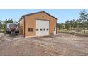 Large outbuilding with ample parking, ideal for RV storage, set in a picturesque landscape at 3562 Pine Meadow Ave, Parker, CO 80138