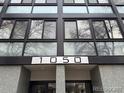Close up of building entrance with stone columns and address 1050 at 1050 N Corona St # 316, Denver, CO 80218
