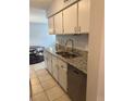Bright kitchen featuring granite countertops, stainless steel appliances and ample space at 7495 E Quincy Ave # 205, Denver, CO 80237