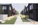 Street view showing the architecture of modern townhomes with clean lines and inviting landscaping at 783 E County Line Rd, Erie, CO 80516