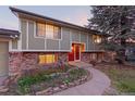 Charming two-story home with red brick and a well-maintained front yard at 12642 E Ohio Ave, Aurora, CO 80012