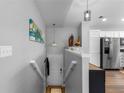 Inviting entryway with stylish lighting, artwork, and access to the kitchen and lower level at 19437 E Mann Creek Dr # A, Parker, CO 80134