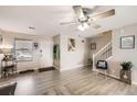 Inviting living room showcasing wood floors, a front door, and a staircase at 11009 Gaylord. St, Northglenn, CO 80233