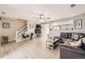 Bright living room featuring wood floors, a ceiling fan and plenty of space at 11009 Gaylord. St, Northglenn, CO 80233