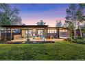Inviting backyard patio with modern furniture, perfect for outdoor relaxation and entertaining in a beautifully landscaped space at 8955 E 19Th Ave, Aurora, CO 80010