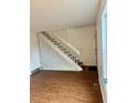 Bright entryway with laminate flooring and staircase at 1920 S Oswego Way, Aurora, CO 80014