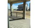Relaxing back deck with views of the neighborhood at 728 N Clubview St, Watkins, CO 80137