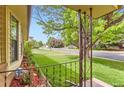 Inviting front yard view showcasing the lush landscaping and a glimpse of the quiet neighborhood street at 2310 Squires Ct, Longmont, CO 80501