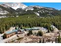 Breathtaking aerial view of resort in lush forest, offering a serene and secluded experience at 4192 Highway 9 # 3, Breckenridge, CO 80424