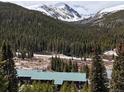 Scenic view of the property nestled among trees and mountains at 4192 Highway 9 # 3, Breckenridge, CO 80424