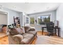 Cozy living space featuring hardwood floors and a workspace bathed in natural light at 4192 Highway 9 # 3, Breckenridge, CO 80424