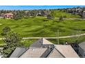 View of roof, green space, and trees at 10040 Longview Dr, Lone Tree, CO 80124