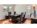 Bright dining room featuring hardwood floors, a large window and dining table at 9651 Bighorn Way, Littleton, CO 80125