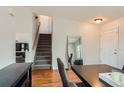 Bright Entryway featuring hardwood floors, staircase and a large mirror at 9651 Bighorn Way, Littleton, CO 80125