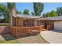 View of house featuring a cozy deck with an awning for shade at 215 Sunland St, Louisville, CO 80027
