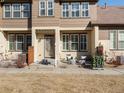 Inviting exterior showcasing the entrance with seating and well-maintained lawn at 5833 S Van Gordon Ln, Littleton, CO 80127