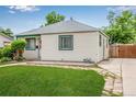 Charming single story home with beautifully maintained lawn and garden area at 1601 S Yates St, Denver, CO 80219