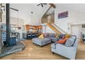 Open living space with hardwood floors, modern kitchen, and cozy fireplace, creating a welcoming atmosphere at 1758 Sinton Rd, Evergreen, CO 80439