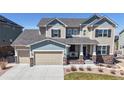 Beautiful two-story home with a three car garage and covered front porch at 8605 S Zante Ct, Aurora, CO 80016
