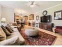 Open-concept living room flowing into the kitchen and dining area, perfect for entertaining at 9625 S Hackberry St, Highlands Ranch, CO 80129