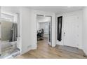 Bright entryway with wood-look floors, a full bath, and access to the office at 14800 Hudson St, Thornton, CO 80602