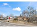 A charming single-story home nestled in a quiet neighborhood, showcasing its well-kept front yard at 343 Melody Dr, Northglenn, CO 80260