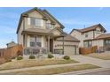 Two-story home with landscaped front yard, covered porch, and two-car garage, set in a suburban neighborhood at 13475 Spruce St, Thornton, CO 80602