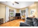 Comfortable living room with hardwood floors, two large windows, and stylish furnishings at 1363 Stuart St, Denver, CO 80204