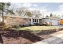 Lovely single-story home with well-manicured lawn and brick accents, featuring a spacious two-car garage at 375 Coral St, Broomfield, CO 80020