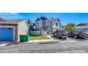 Townhome complex showcasing well-maintained landscaping and assigned parking spaces at 23413 E Dorado Pl # A, Aurora, CO 80016