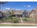 Attractive single-Gathering home boasts a secure chain-link fence and tidy landscaping at 3921 S Acoma St, Englewood, CO 80110