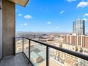 Enjoy the breathtaking city views from the private balcony with glass railings at 891 14Th St # 3204, Denver, CO 80202