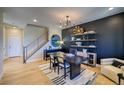 Chic living space with a modern staircase, stylish decor, and plenty of natural light at 8795 Hugo Dr, Littleton, CO 80125