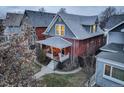 Charming two-story brick home featuring a cozy front porch and well-maintained front yard in a residential neighborhood at 515 S Grant St, Denver, CO 80209