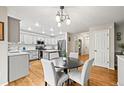 Inviting kitchen with granite counters, stainless appliances, and adjacent dining area at 2667 E 132Nd Ave, Thornton, CO 80241