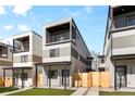 Modern townhomes featuring private balconies, fenced entries and attractive landscaping, bathed in bright natural light at 1737 Lowell Blvd, Denver, CO 80204