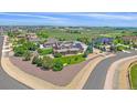 Aerial view of a two-story home with mature trees and professional landscaping at 8655 E 130Th Ave, Thornton, CO 80602
