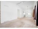 Spacious living room featuring a vaulted ceiling and plenty of natural light at 16035 E Ithaca Pl # D, Aurora, CO 80013