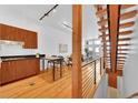 Spacious kitchen with wood cabinets, stainless steel appliances, and an island with bar seating at 2680 Blake St # 13, Denver, CO 80205
