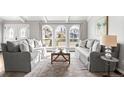 Comfortable living room with neutral tones and lots of natural light at 10795 E Powers Dr, Englewood, CO 80111