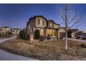 Beautiful home with well-manicured front lawn and inviting entryway on a sunny day at 2618 S Kilmer Ct, Denver, CO 80228