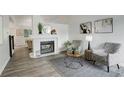 Inviting living area with a fireplace, neutral decor, and modern furniture at 21486 E Crestline Ln, Centennial, CO 80015