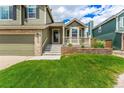 Charming two-story home featuring an attached two-car garage and well-maintained lawn at 863 Homestead Dr, Highlands Ranch, CO 80126