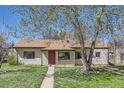 Charming single-story home with a well-maintained lawn and mature trees in a peaceful setting at 2865 S Fairfax St, Denver, CO 80222