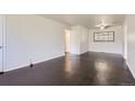 Bright living room featuring beautiful dark hardwood floors and modern ceiling fan at 2865 S Fairfax St, Denver, CO 80222