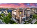 Beautiful modern townhouse featuring balconies, landscaping, and neighborhood views at 10305 Martin Luther King Blvd, Denver, CO 80238