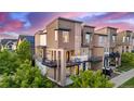Aerial view of townhouse with private balconies, and modern architectural features at 10305 Martin Luther King Blvd, Denver, CO 80238