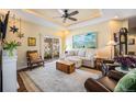Comfortable living room featuring a sliding glass door, hardwood flooring, and modern decor at 7930 Larkspur Cir, Frederick, CO 80530